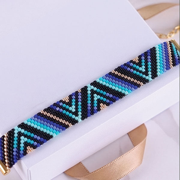 Set of handmade Miyuki bead bracelets with ocean-inspired geometric patterns in turquoise, aqua, navy, and black tones featuring 24K gold plated beads