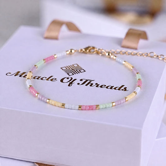 Handmade Miyuki bead anklet in pastel pink, mint, ivory and gold with 24K gold plated beads and adjustable chain