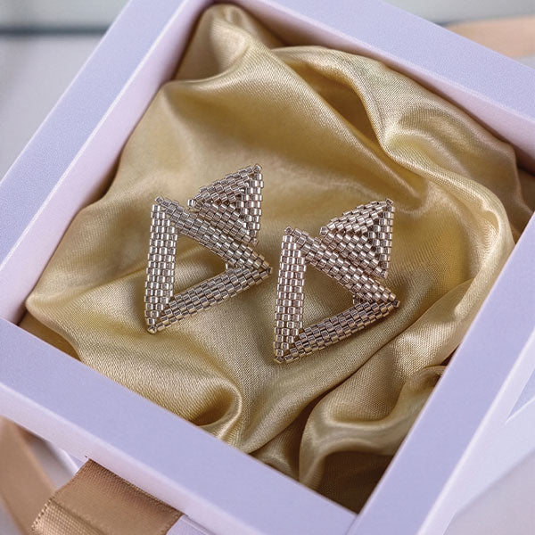 Handmade Miyuki bead triangle earrings in gold tone with geometric design and 24K gold plated elements displayed in gift box