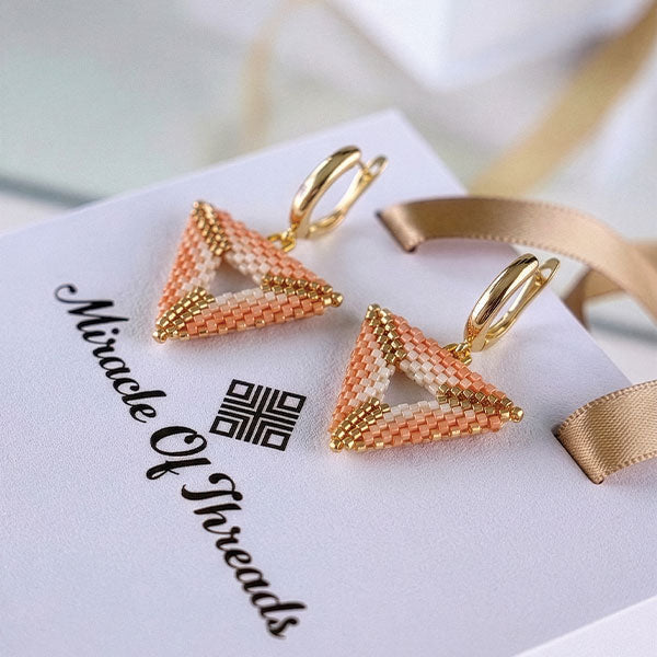 Handmade Miyuki bead triangle earrings in blush, ivory, and gold tones with 24K gold plated elements and hoop closure