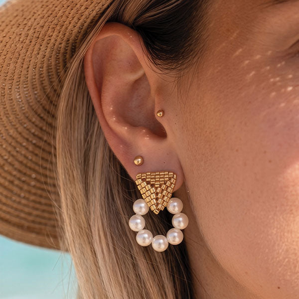 Handmade Miyuki bead earrings with geometric gold triangle design and pearl hoop detailing with 24K gold plated elements