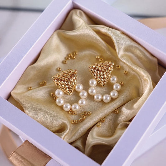 Handmade Miyuki bead earrings with geometric gold triangle design and pearl hoop detailing with 24K gold plated elements