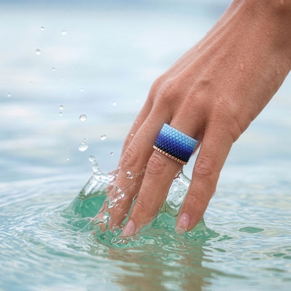 Handmade Miyuki bead ring with blue gradient ombré design displayed on jewelry box