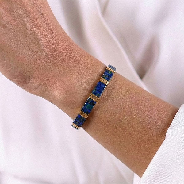 Handmade Miyuki Tila bead bracelet with blue tones and 24K gold-plated beads in a geometric flat design