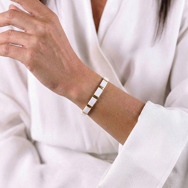 Handmade Miyuki Tila bead bracelet in ivory white with 24K gold-plated accents and minimalist flat design