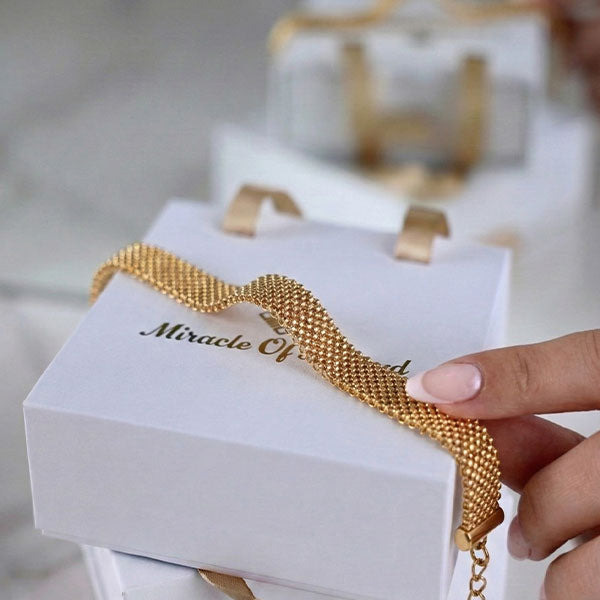 Handmade gold Miyuki bead bracelet with woven mesh texture and 24K gold plated beads on wrist